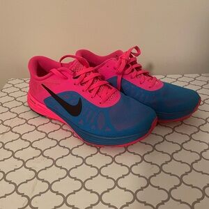 Blue and pink Nike shoes